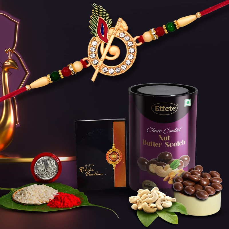 Krishna Flute Rakhi with Choco Nut Butterscotch, Coin, Tilak & Greeting Card Combo